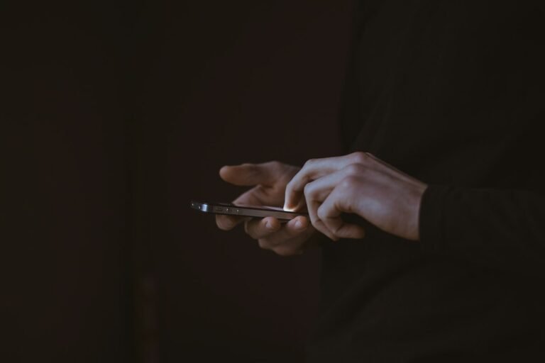 Man using his phone to download the Muse AI APK in Pakistan